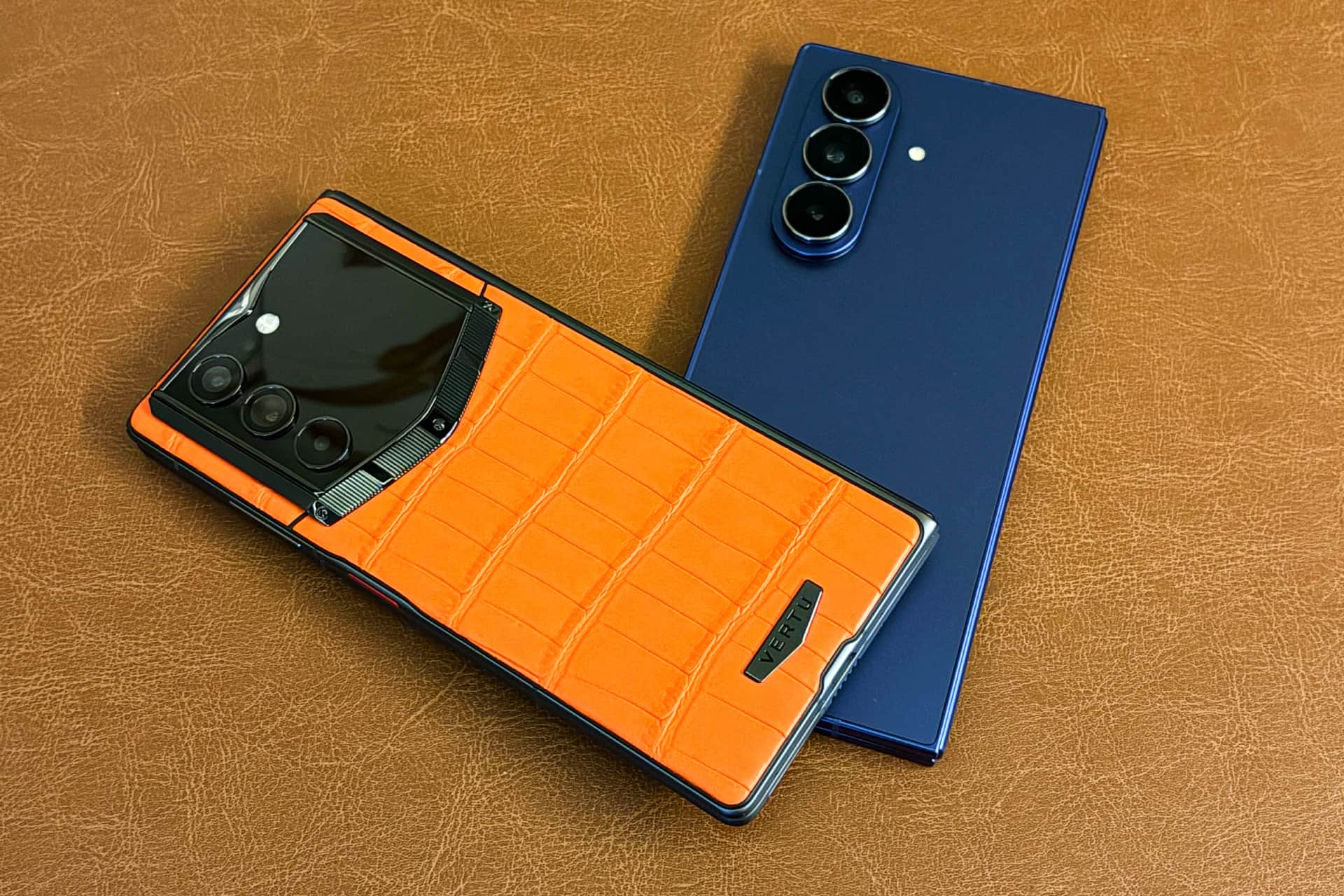 Vertu’s Alphafold with a calfskin leather back and Samsung’s Galaxy Z Fold 7 with a glass back