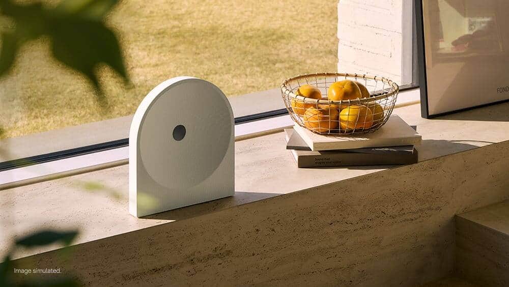 White Samsung Music Studio 5 speaker on a windowsill by a window