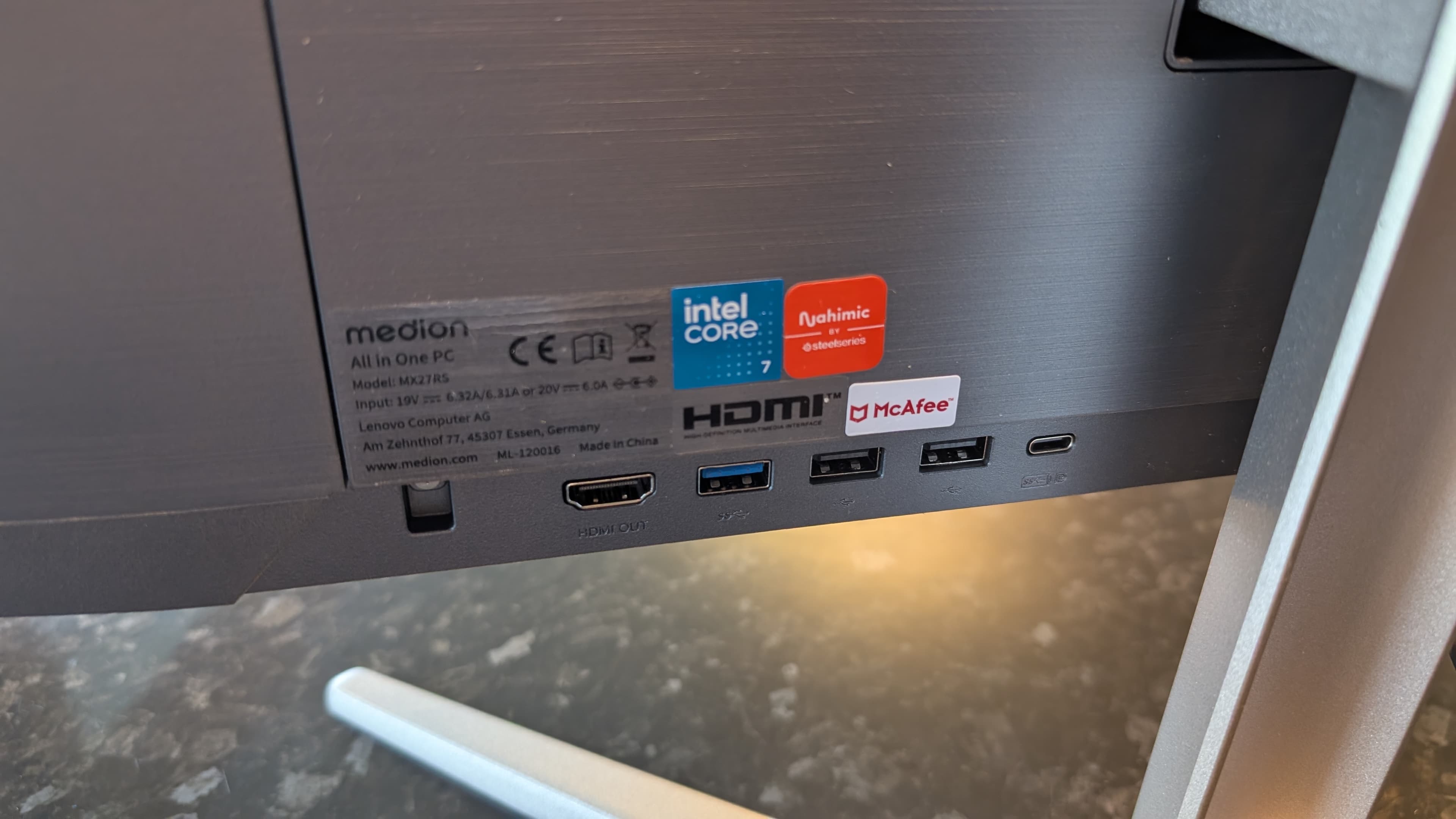 The Medion Signium 27 S1 all-in-one desktop pictured on a marble worksurface.