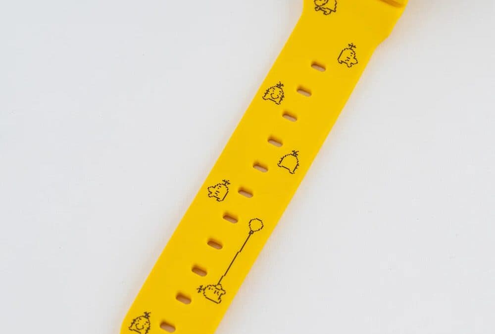 Yellow G-Shock watch with pixel-art drawings from Mother 3
