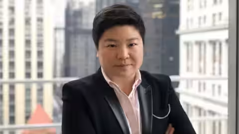 Reddit Jen Wong wearing a black jacket with a light pink shirt