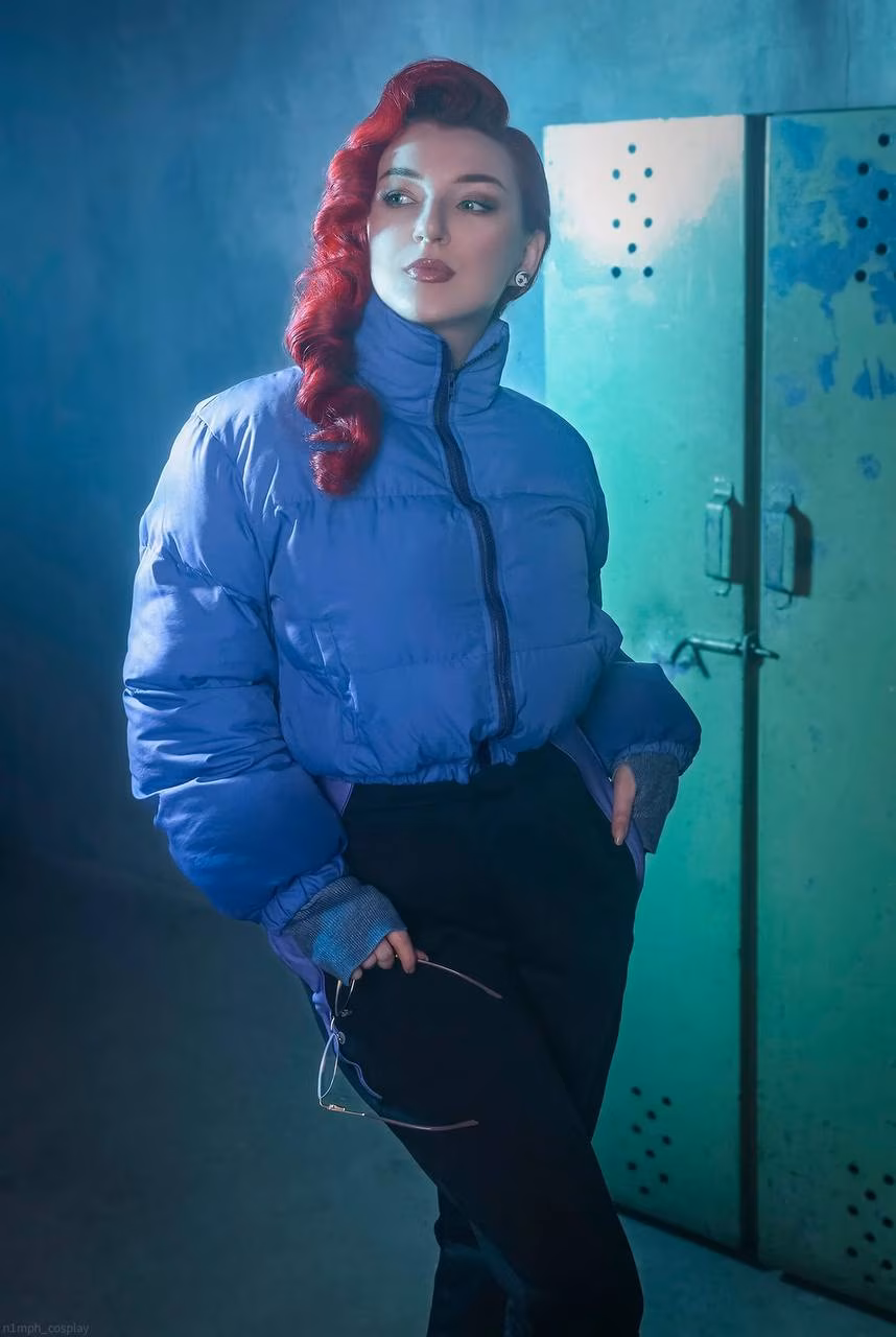 Model cosplaying Anastasia Nazarova in blue jacket and black pants from Atomic Heart