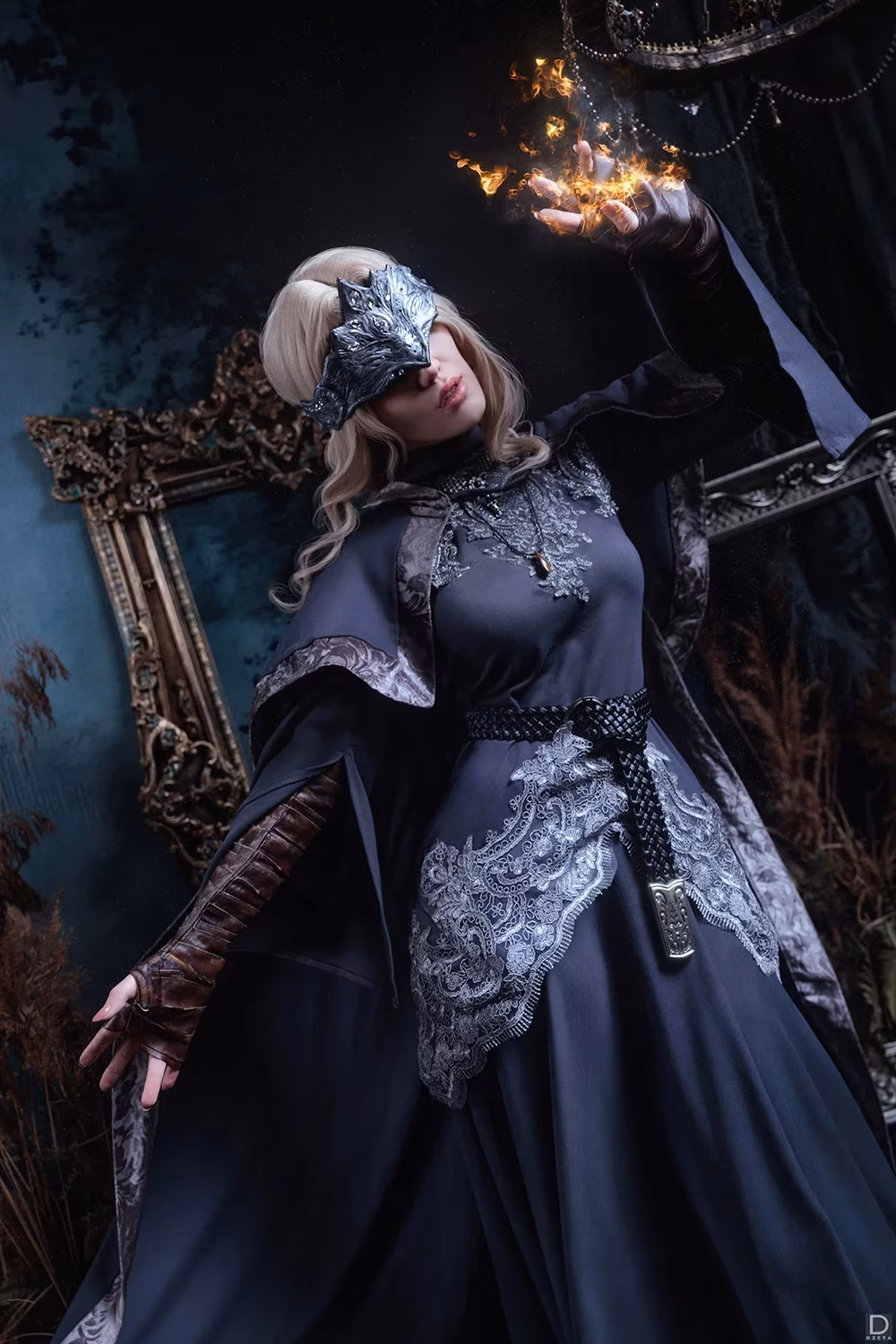 Witch in mask holding fire in hand Dark Souls 3