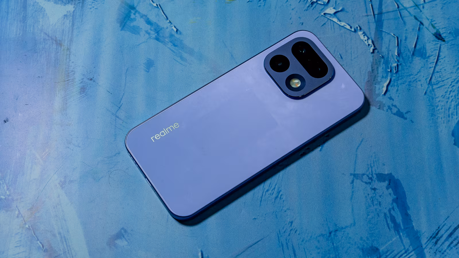 Realme 16 Pro 5G smartphone on blue background