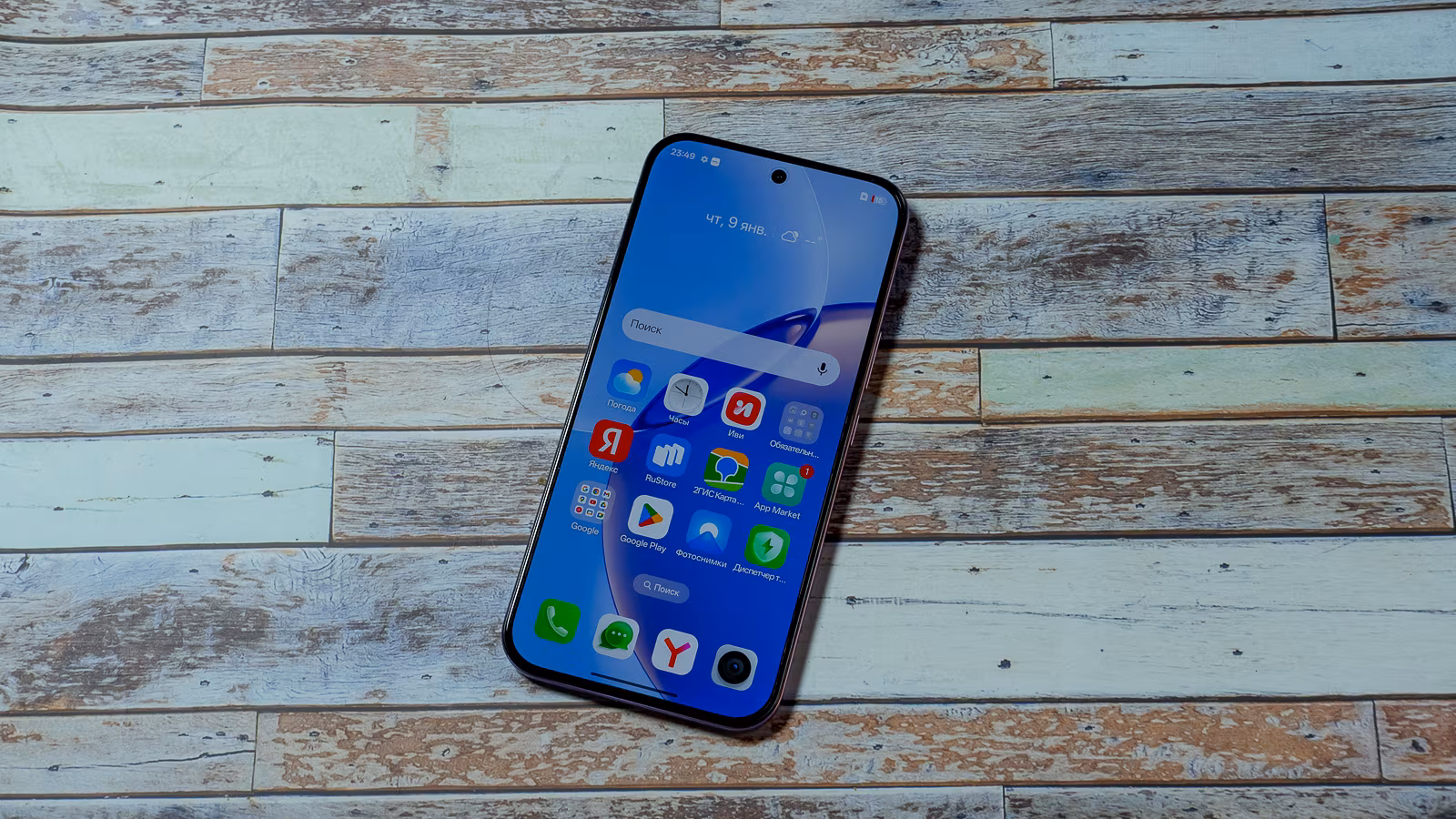 Realme 16 Pro 5G smartphone on wooden table