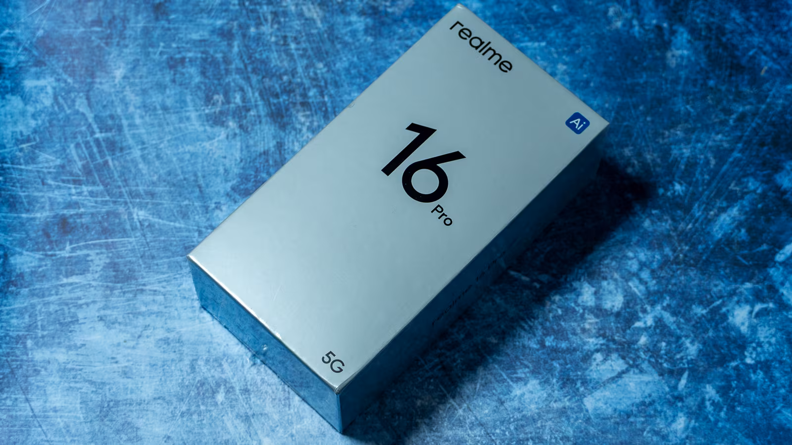 Realme 16 Pro 5G box on blue background