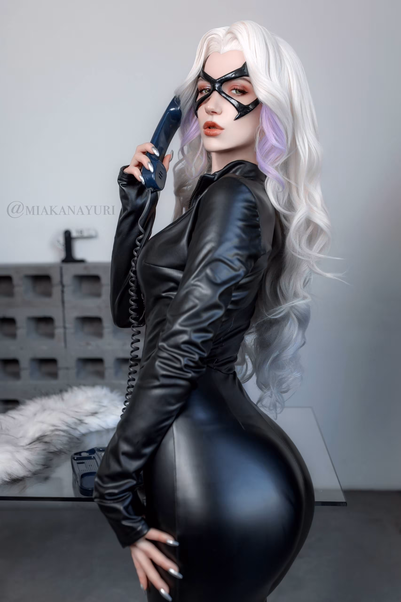 Woman in black leather jacket and mask from Marvel Rivals
