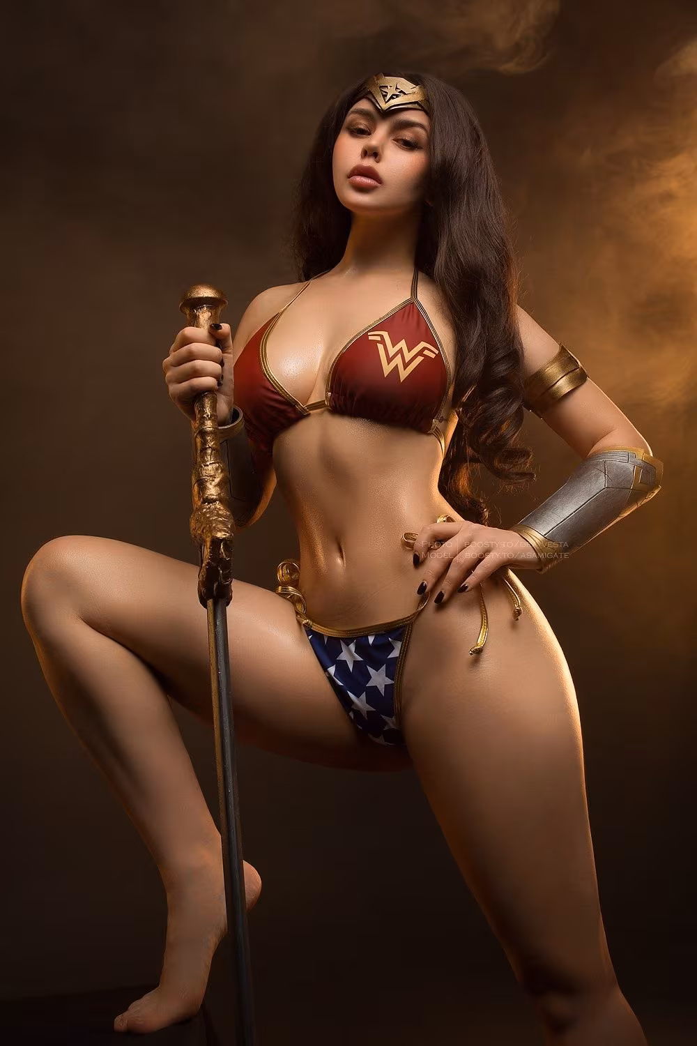 Woman in DC Wonder Woman costume with sword