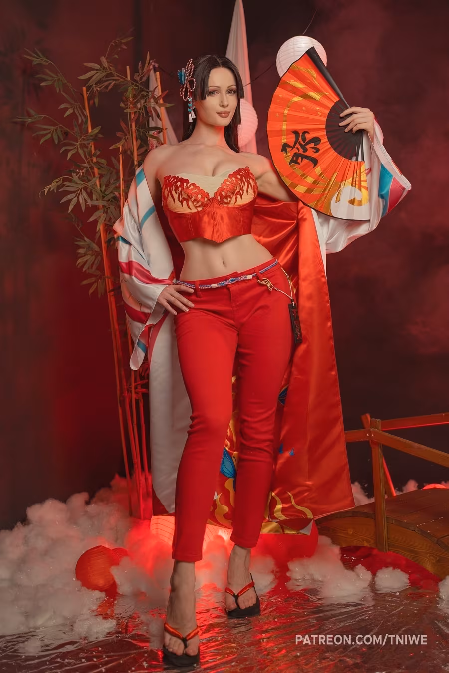Model in bright Mai Shiranui cosplay costume