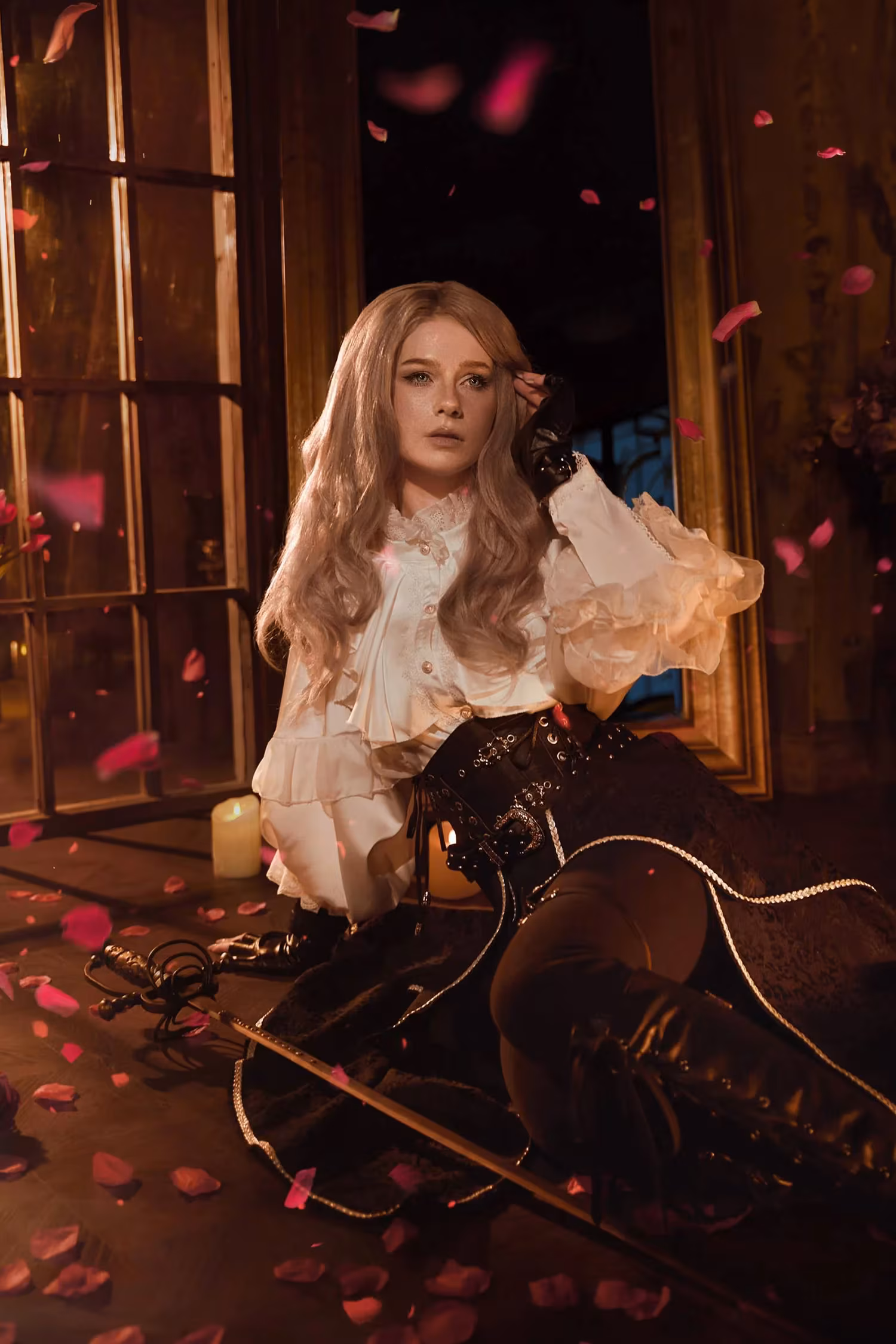 Cosplayer in retro style with black gloves near candle