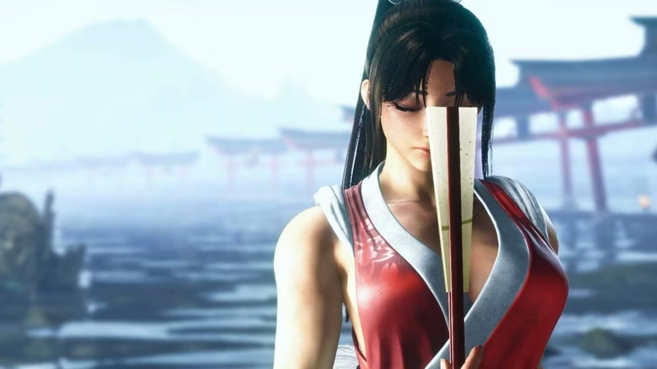Model cosplaying Mai Shiranui from Fatal Fury in red dress holding a fan