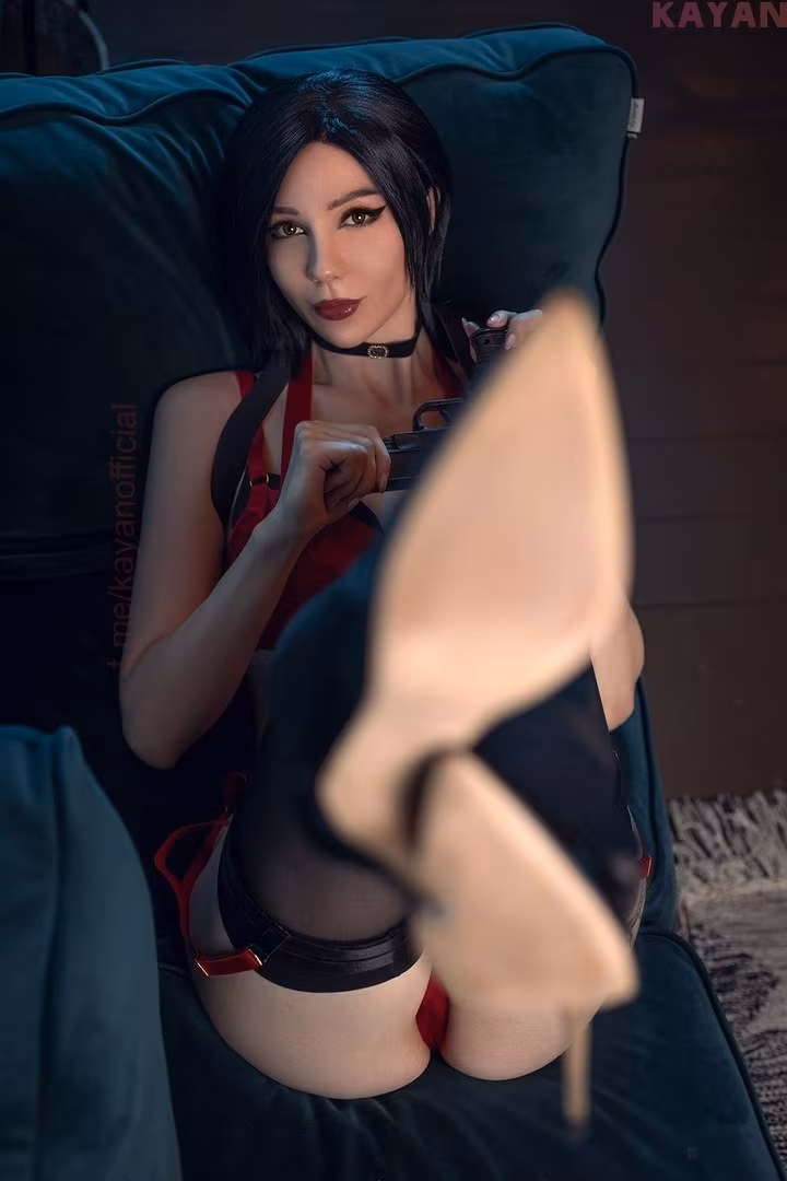 Ada Wong cosplay by KayaNilson lounging on a sofa