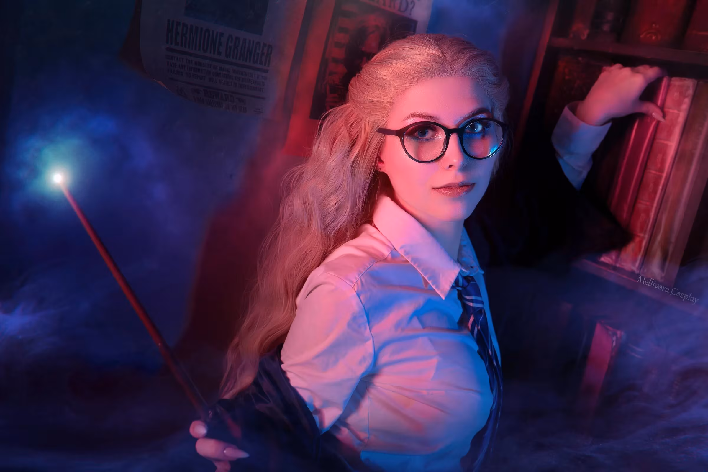 Three models showcasing Slytherin and Ravenclaw cosplay
