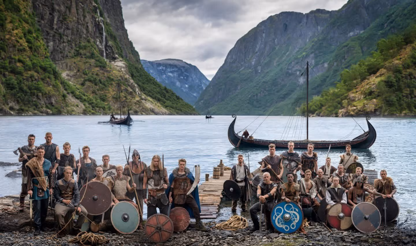 group of people in Viking costumes on riverbank