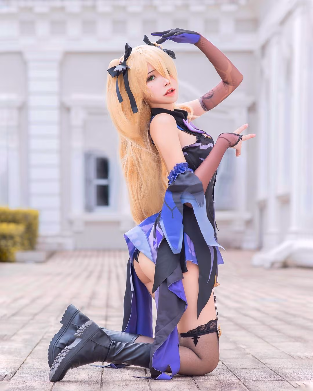 Fischl cosplay Asian woman kneeling in outdoor setting