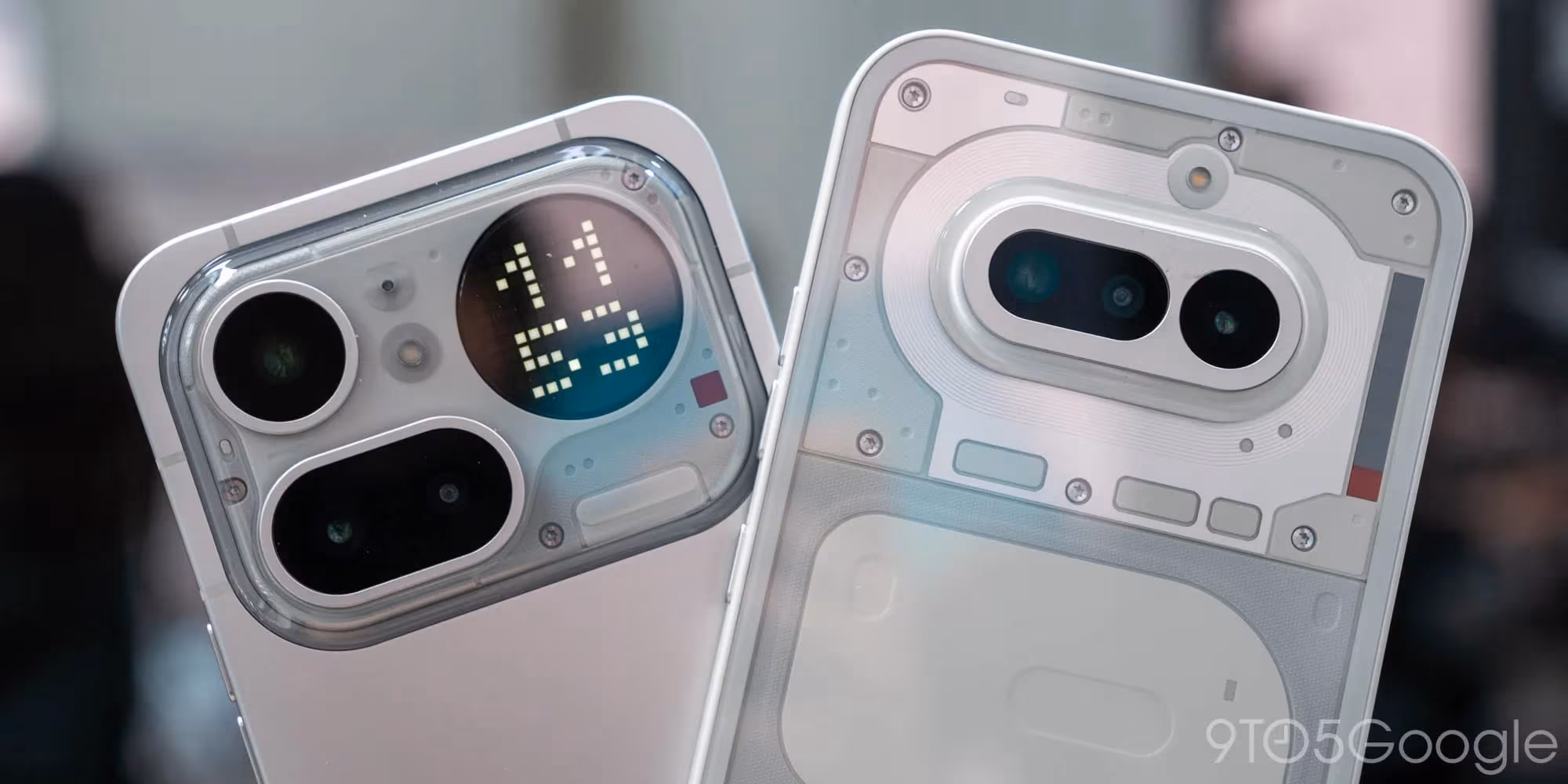 Two OnePlus smartphones showing camera and display