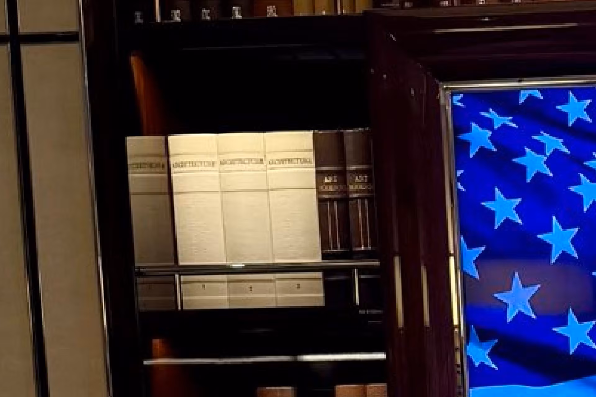 Doors, plaques, American flag, interior of a presidential office