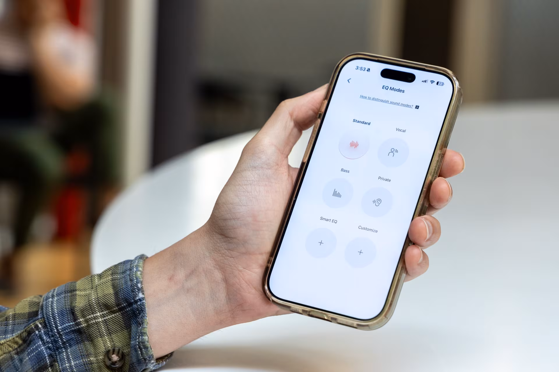 Smartphone with EQ Modes app screen