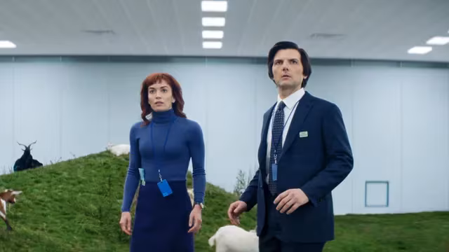 People in green field with animals and office attire from Apple TV